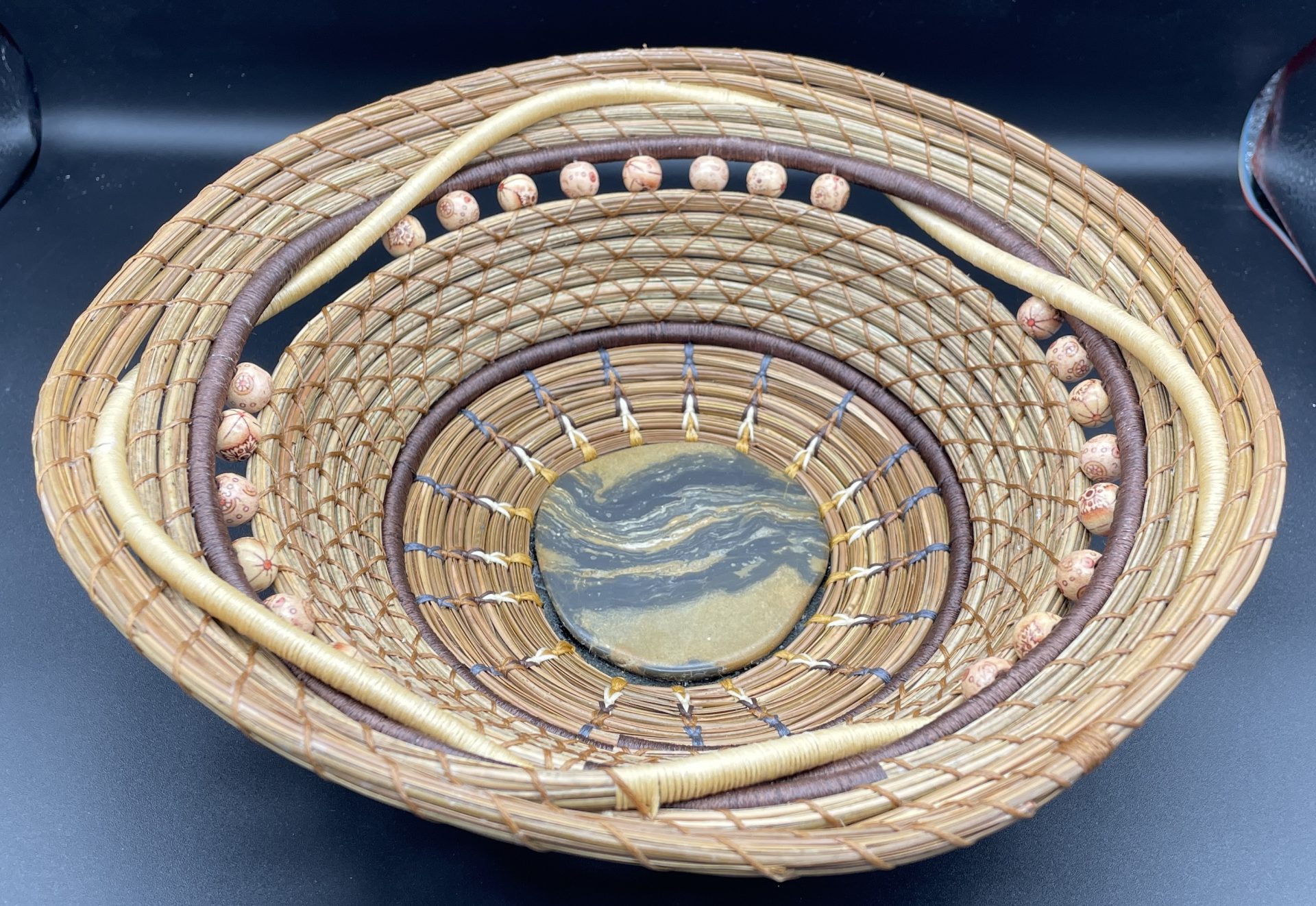 Intertwined pine needle basket