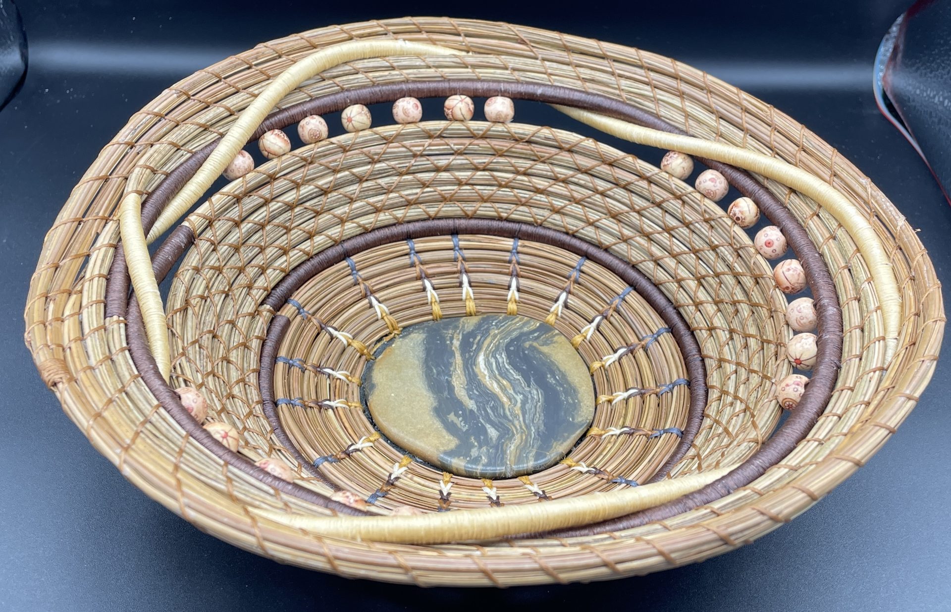 Intertwined pine needle basket